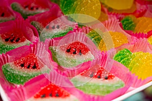 French or italian sweets, fruit jelly bonbons on display in confectionery shop in Milan, Italy close up