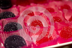 French or italian sweets, fruit jelly bonbons on display in confectionery shop in Milan, Italy close up