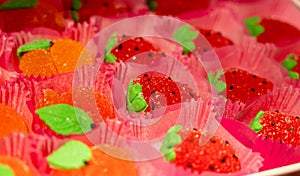 French or italian sweets, fruit jelly bonbons on display in confectionery shop in Milan, Italy close up