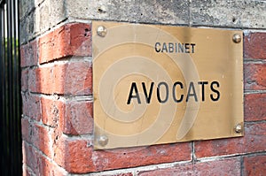 French lawyer sign in building entry facade