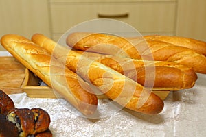 French loaves on the kitchen table. French bread