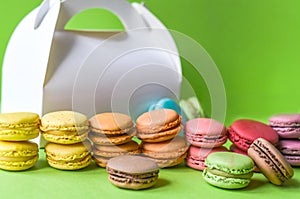 French macarons over a green background