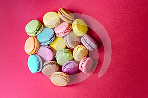 French macarons over a red background