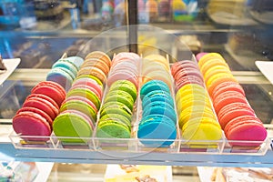 French macarons for sale on glass showcase