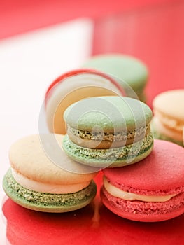 French macaroons on red background, parisian chic cafe dessert, sweet food and cake macaron for luxury confectionery brand,