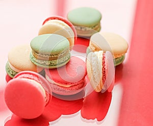 French macaroons on red background, parisian chic cafe dessert, sweet food and cake macaron for luxury confectionery brand,