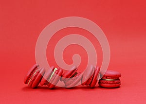 French macaroons stack on red backgrouds photo