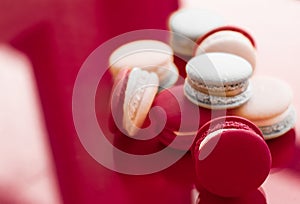French macaroons on wine red background, parisian chic cafe dessert, sweet food and cake macaron for luxury confectionery brand,