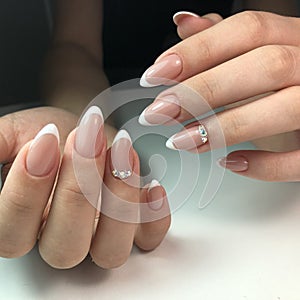 French manicure on the nails. French manicure design. Manicure gel nail polish