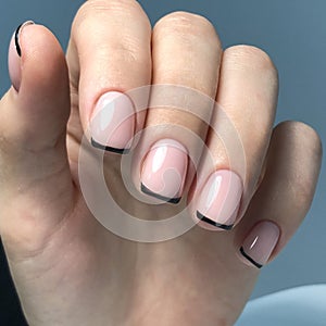 French manicure on the nails. French manicure design. Manicure gel nail polish