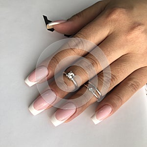 French manicure on the nails. French manicure design. Manicure gel nail polish