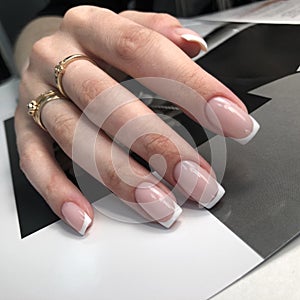 French manicure on the nails. French manicure design. Manicure gel nail polish