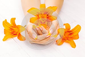 French manicure with orange lily. spa