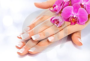 French manicure with orchids