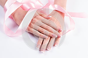 French manicure with pink ribbon.