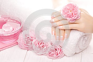 French manicure with rose flowers. spa