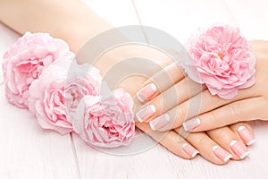 French manicure with rose flowers. spa