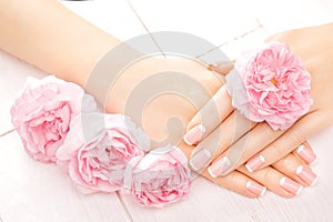 French manicure with rose flowers. spa