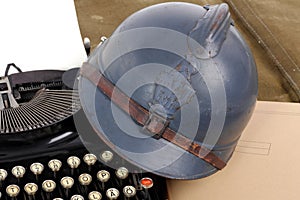 French military helmet of the First World War with old typewrite