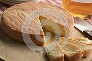 French Munster cheese and slices photo