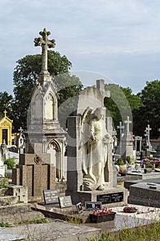 French old cemetery with white crosses and memorials photo