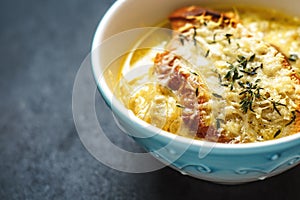 French onion soup in blue ceramic bowl