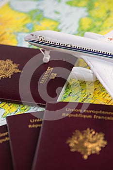 French passports on map and plane background