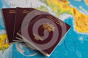 French passports on map and plane background