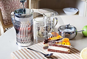 French press, cup of tea and sponge cake with orange, Provence