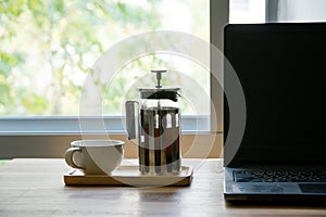 French press with laptop
