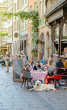 French restaurant outdoor with customers waiting enjoying food w