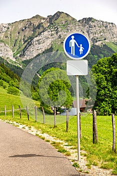 French road sign caution children over mountains panorama