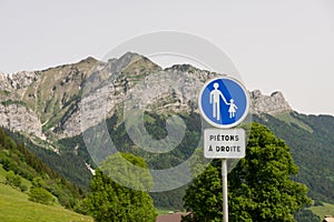 French road sign caution children over mountains  pedestrians on the right