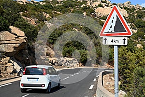 French road sign indicating a risk of rockfall over four kilometers