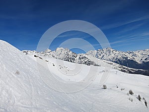 French ski slopes and blue sky with clouds