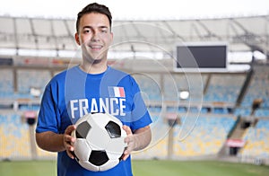 French soccer fan with ball at stadium