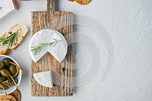French soft camembert of normandy cheese, on white background, flat lay  with copy space for text