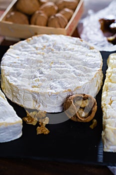 French soft cheeses - camembert, marcaire, munster, brie - delicious dessert with nuts and dried fruits