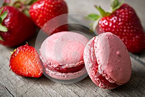 French speciality macaron and a strawberry