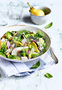 French style autumn salad with pears, walnuts and blue cheese