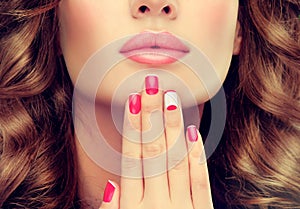 French-style red manicured nails.