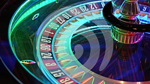 French style roulette table for money playing in Las Vegas, USA. Spinning wheel with black and red sectors for risk game