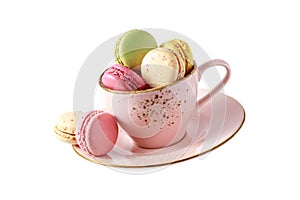 French sweet colorful cookies macarons macaroons in vintage pink cup flying isolated  on white background
