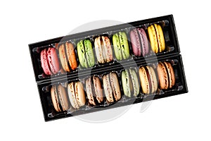French sweet colorful mixed cookies macarons macaroons in black paper box flying isolated on white