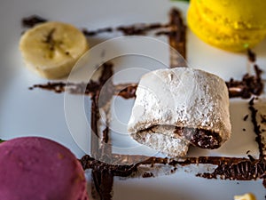 French sweets and fruits in closeup view.