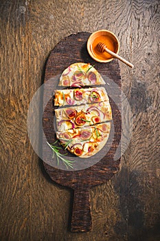 French Tarte Flambee (Flammkuchen) with figs, red onions, soft goat cheese and honey