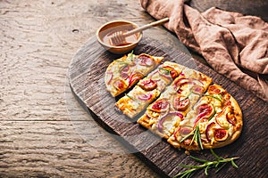 French Tarte Flambee (Flammkuchen) with figs, red onions, soft goat cheese and honey