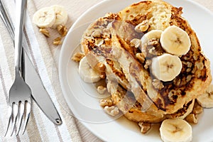 French toast with bananas, walnuts and maple syrup