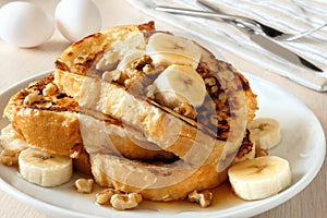 French toast with bananas, walnuts and maple syrup