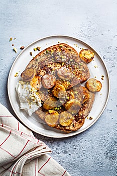 French toast with caramelized banana and pistachios